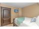 Bright bedroom with a double bed, TV, and access to a balcony at 201 74Th Ave. N # 1002, Myrtle Beach, SC 29572