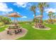 Beachfront patio area with picnic tables and umbrellas at 201 74Th Ave. N # 1002, Myrtle Beach, SC 29572