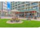 Outdoor patio seating area with picnic tables near the beach at 201 74Th Ave. N # 1002, Myrtle Beach, SC 29572