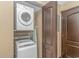 Compact laundry area with stacked washer and dryer units at 201 74Th Ave. N # 1002, Myrtle Beach, SC 29572