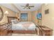 Bedroom with a queen bed and mounted TV at 201 74Th Ave. N # 1002, Myrtle Beach, SC 29572