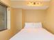 Small bedroom with a double bed and window with mini blinds at 201 74Th Ave. N # 1002, Myrtle Beach, SC 29572