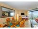 Ocean view dining area with glass-top table and chairs at 201 74Th Ave. N # 1002, Myrtle Beach, SC 29572