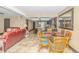 Dining area with glass-top table and wicker chairs at 201 74Th Ave. N # 1002, Myrtle Beach, SC 29572