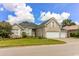 Brick house with a three-car garage and manicured lawn at 3412 Westminster Dr., Myrtle Beach, SC 29588