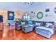 Open living room with sectional sofa and hardwood floors at 3412 Westminster Dr., Myrtle Beach, SC 29588
