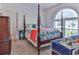 Bright bedroom with a post bed, large window, and ample closet space at 3412 Westminster Dr., Myrtle Beach, SC 29588