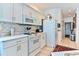 Bright kitchen with white cabinets, modern appliances, and tile flooring at 3412 Westminster Dr., Myrtle Beach, SC 29588