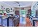 Spacious living room with hardwood floors and access to pool at 3412 Westminster Dr., Myrtle Beach, SC 29588