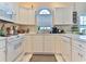 Efficient kitchen with white cabinets and ample counter space at 3412 Westminster Dr., Myrtle Beach, SC 29588
