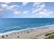 Aerial view of a sandy beach with ocean and blue sky at 2401 Ocean Blvd. S # 1062, Myrtle Beach, SC 29577