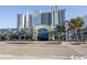 Oceanfront resort building with many balconies and palm trees at 2401 Ocean Blvd. S # 1062, Myrtle Beach, SC 29577