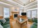 Living room with hardwood floors, fireplace, comfortable seating, and access to deck at 758 Parker Dr., Pawleys Island, SC 29585