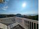 Relaxing deck overlooking the ocean with white lounge chairs at 758 Parker Dr., Pawleys Island, SC 29585