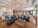 Open concept living room with hardwood floors, comfortable seating, and views to kitchen at 758 Parker Dr., Pawleys Island, SC 29585