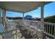 Spacious porch with multiple rocking chairs and ocean view at 758 Parker Dr., Pawleys Island, SC 29585