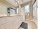 Clean bathroom with double vanity and a large mirror at 758 Parker Dr., Pawleys Island, SC 29585