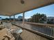 Screened porch with rocking chairs and neighborhood view at 758 Parker Dr., Pawleys Island, SC 29585