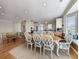 Bright dining room with hardwood floors, large table, and built-in bench seating at 758 Parker Dr., Pawleys Island, SC 29585