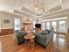 Living room with hardwood floors, fireplace, access to deck, and comfortable seating at 758 Parker Dr., Pawleys Island, SC 29585