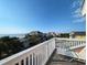 Ocean view from a deck with white railings and lounge chair at 758 Parker Dr., Pawleys Island, SC 29585