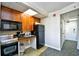 Small kitchenette with microwave, stove, and refrigerator at 1200 N Ocean Blvd. # 308, Myrtle Beach, SC 29577