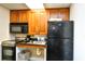 Compact kitchen featuring microwave, stove, and refrigerator at 1200 N Ocean Blvd. # 308, Myrtle Beach, SC 29577
