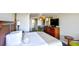 King-size bed, dresser, and ocean view in a hotel room at 1200 N Ocean Blvd. # 308, Myrtle Beach, SC 29577