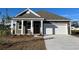 Gray exterior house with white garage door and front porch at 295 Ridley St, Longs, SC 29568