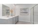 Clean bathroom with gray vanity, quartz countertop, and a large walk-in shower at 555 Duvall St., Longs, SC 29568