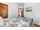 Bedroom with a blue and white comforter and wood door at 1024 Lakeside Dr., Surfside Beach, SC 29575