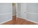 Well-lit bedroom featuring hardwood floors and an open doorway at 1916 Jasper St., Georgetown, SC 29440