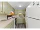 Galley kitchen with light green cabinets at 6001 - 1824 S Kings Hwy., Myrtle Beach, SC 29575
