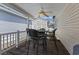 Covered back porch with seating area and ceiling fan at 6001 - 1824 S Kings Hwy., Myrtle Beach, SC 29575