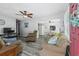 Bright living room with comfy sofas, hardwood floors, and ceiling fan at 6001 - 1824 S Kings Hwy., Myrtle Beach, SC 29575