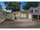 Attractive tan home with covered porch, illuminated at night at 6001 - 1824 S Kings Hwy., Myrtle Beach, SC 29575