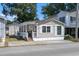 Tan single story home with covered porch and small yard at 6001 - 1824 S Kings Hwy., Myrtle Beach, SC 29575