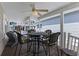 Covered back porch with seating area and ceiling fan at 6001 - 1824 S Kings Hwy., Myrtle Beach, SC 29575