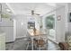 Dining area with wooden table and white chairs at 6001 - 1824 S Kings Hwy., Myrtle Beach, SC 29575