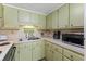 Galley kitchen with light green cabinets at 6001 - 1824 S Kings Hwy., Myrtle Beach, SC 29575