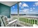 Balcony with ocean view and pier in the distance at 116 South Waccamaw Dr. # 204, Garden City Beach, SC 29576