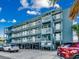 Three-story building with parking and ocean views at 116 South Waccamaw Dr. # 204, Garden City Beach, SC 29576