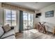Living area with ocean view and sliding glass doors at 116 South Waccamaw Dr. # 204, Garden City Beach, SC 29576