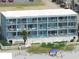 Aerial view of a multi-unit building near the beach at 116 South Waccamaw Dr. # 204, Garden City Beach, SC 29576