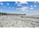 Relaxing beach view with a pier in the distance at 116 South Waccamaw Dr. # 204, Garden City Beach, SC 29576