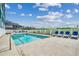 Community pool with lounge chairs and ocean views at 116 South Waccamaw Dr. # 204, Garden City Beach, SC 29576