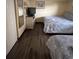 Bedroom featuring two double beds and dark wood flooring at 7100 N Ocean Blvd. # 523, Myrtle Beach, SC 29572