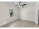 Bedroom with light flooring, window, and ceiling fan at 124 South Shore Blvd. # 303, Longs, SC 29568