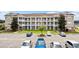 Three-story apartment building with parking in front at 124 South Shore Blvd. # 303, Longs, SC 29568