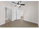 Bedroom with ceiling fan and double doors to closet at 124 South Shore Blvd. # 303, Longs, SC 29568